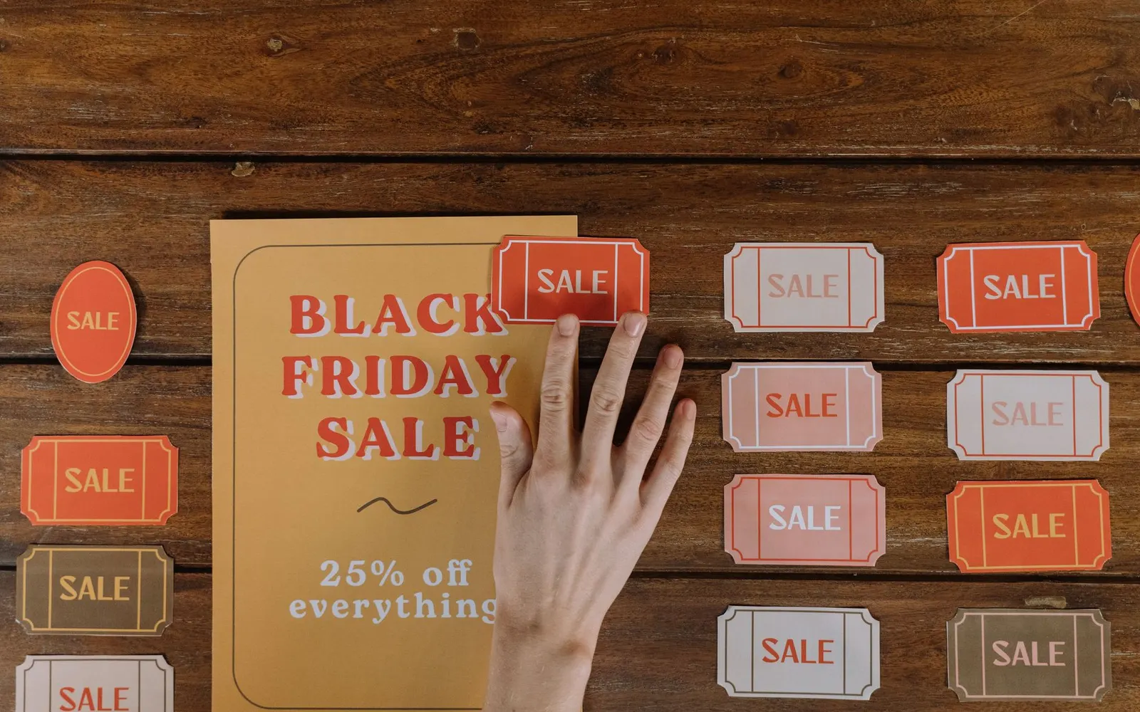 Price tags on a wooden table — comparing Jacksonville website prices