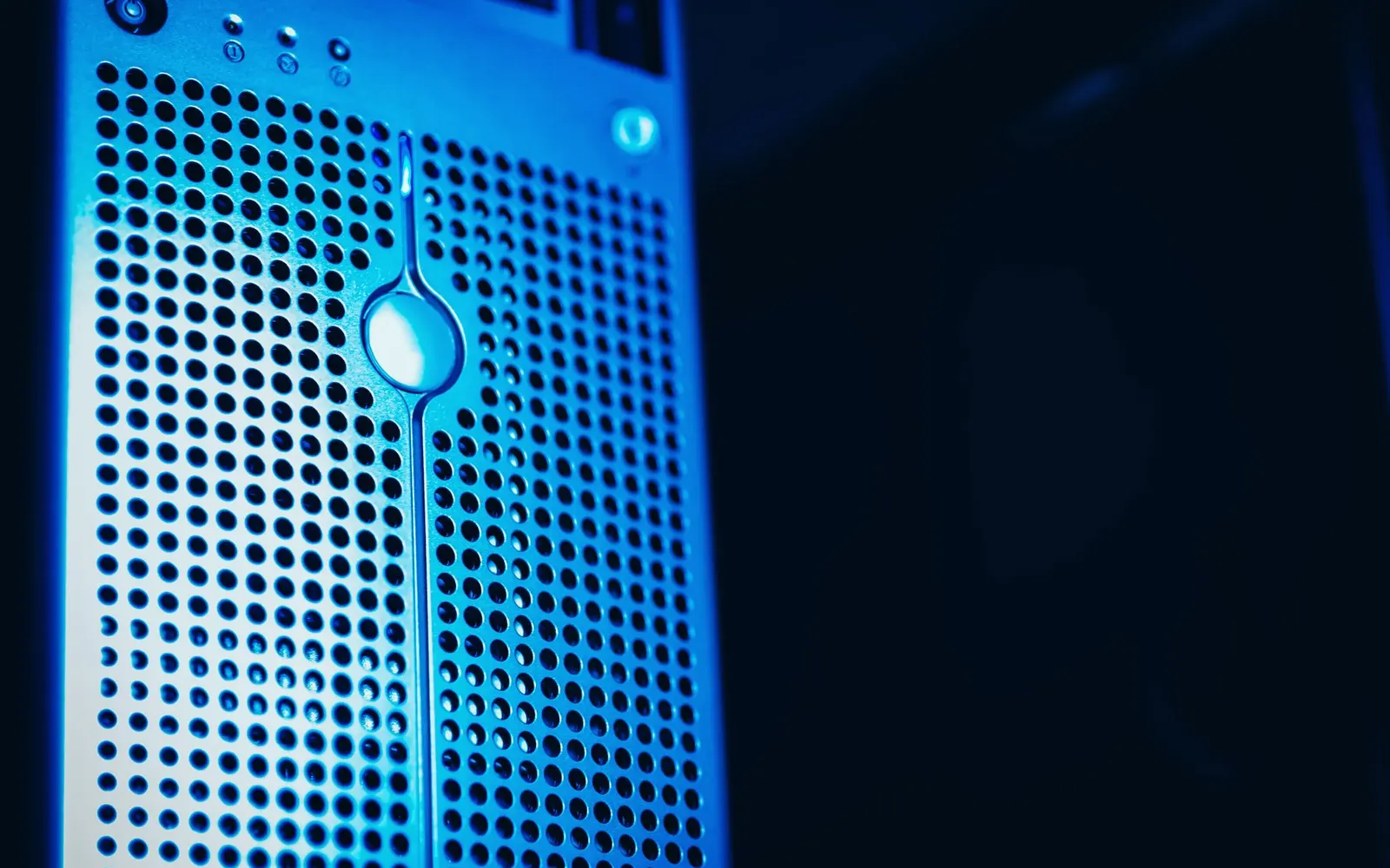 Blue-lit server in a data center — cheap hosting is a common reason a website is slow